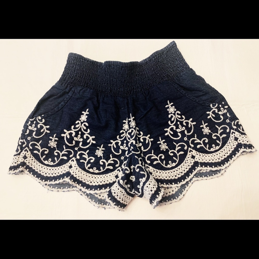 Blue shorts with white designs